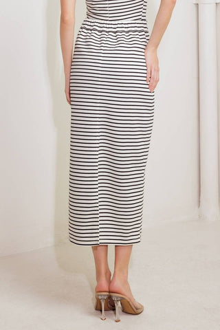 A striped woven skirt featuring front pocket, elasticized back waist and back slit
