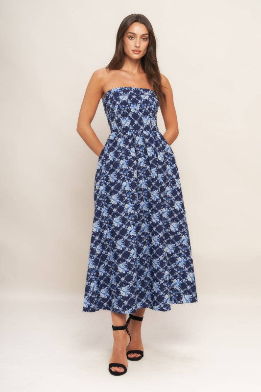 A textured woven midi dress featuring strapless, full skirt and smocked back bodices