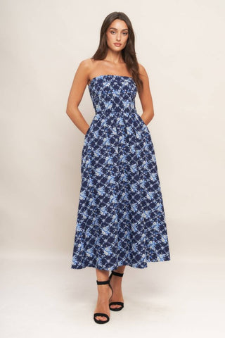 A textured woven midi dress featuring strapless, full skirt and smocked back bodices