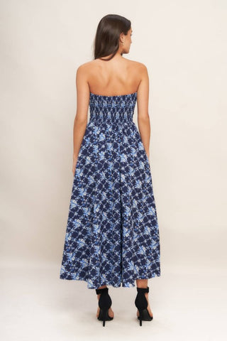 A textured woven midi dress featuring strapless, full skirt and smocked back bodices