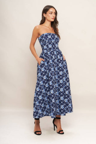 A textured woven midi dress featuring strapless, full skirt and smocked back bodices