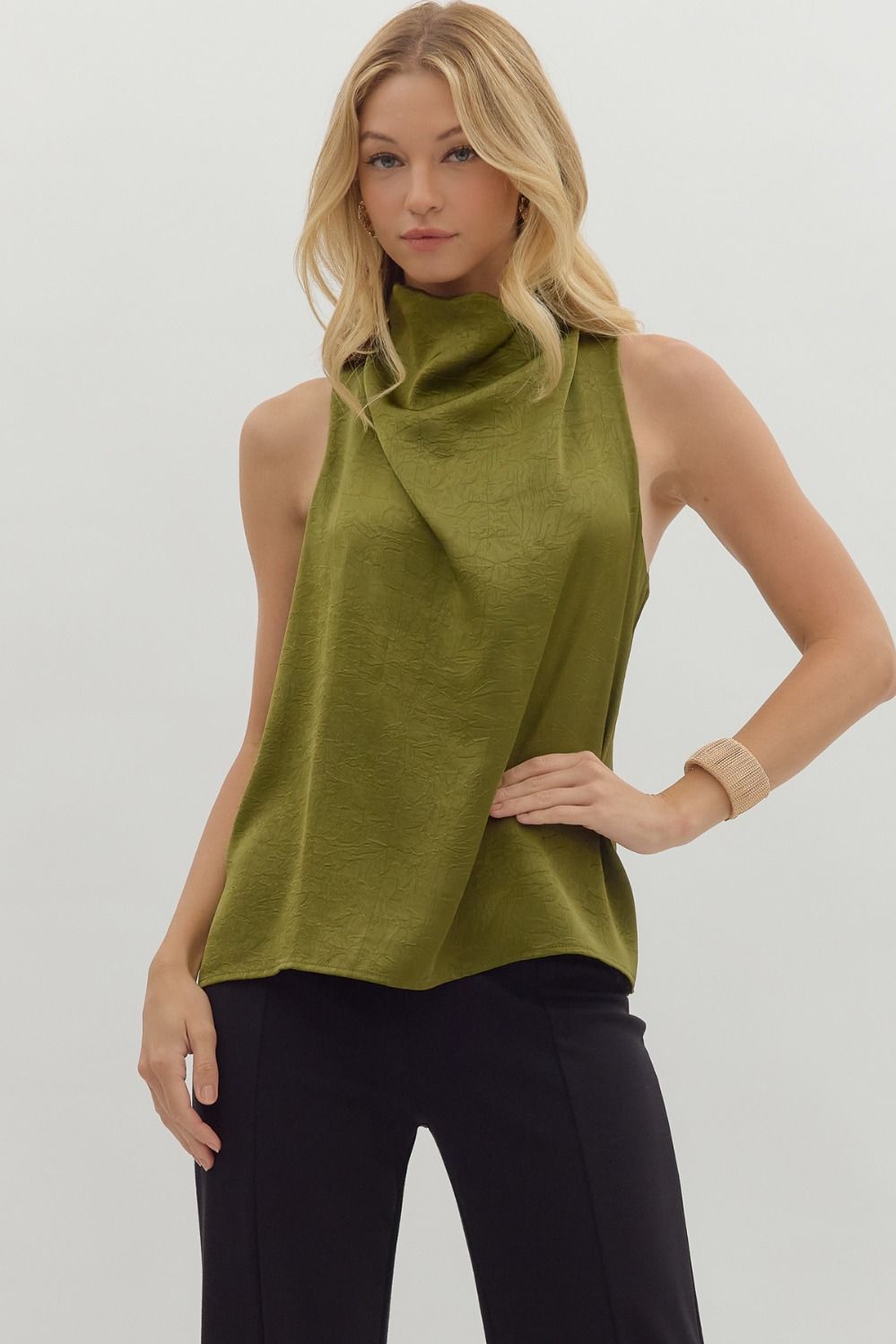 Solid sleeveless mock neck top featuring draped front and back keyhole with button closure