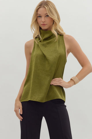 Solid sleeveless mock neck top featuring draped front and back keyhole with button closure