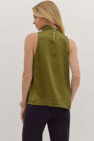 Solid sleeveless mock neck top featuring draped front and back keyhole with button closure
