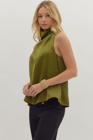 Solid sleeveless mock neck top featuring draped front and back keyhole with button closure