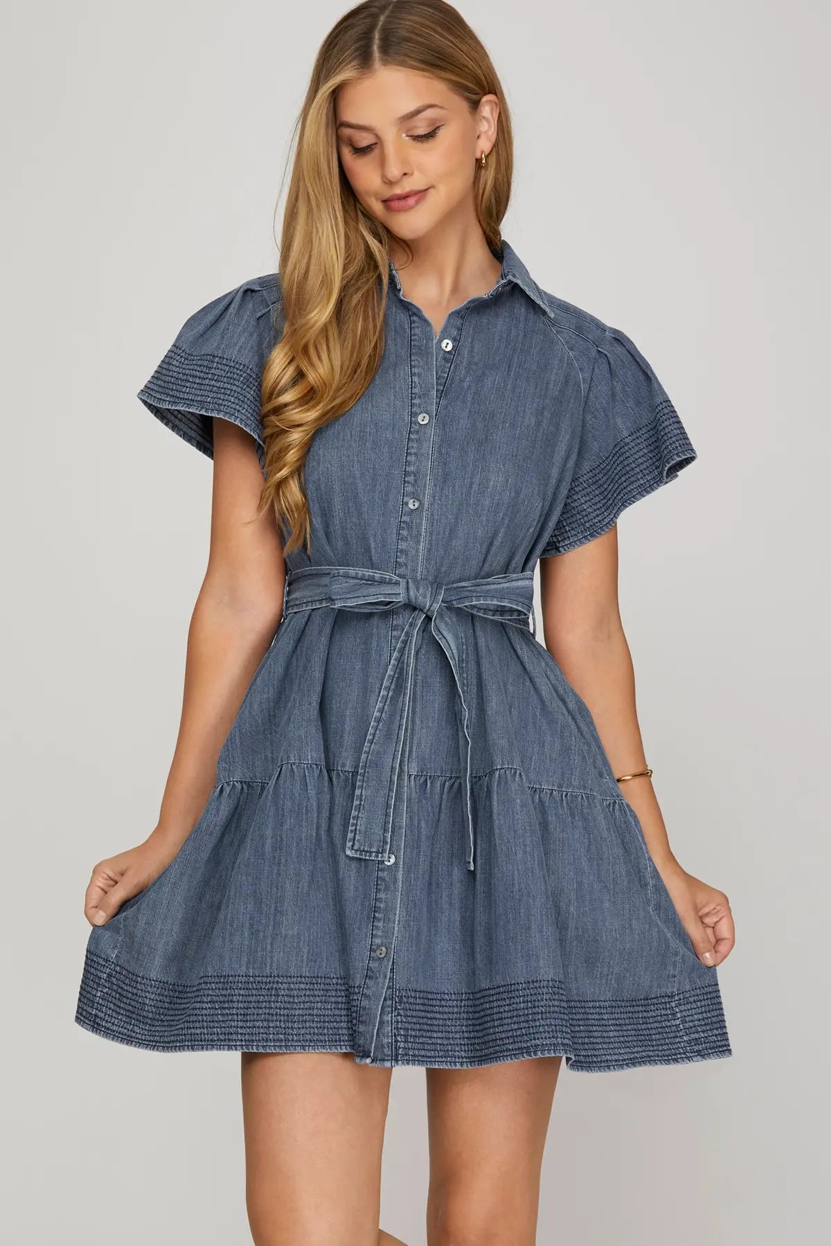 STITCHED FLOUNCE SLEEVE BUTTON DOWN WASHED DENIM DRESS WITH WAIST TIE AND POCKETS