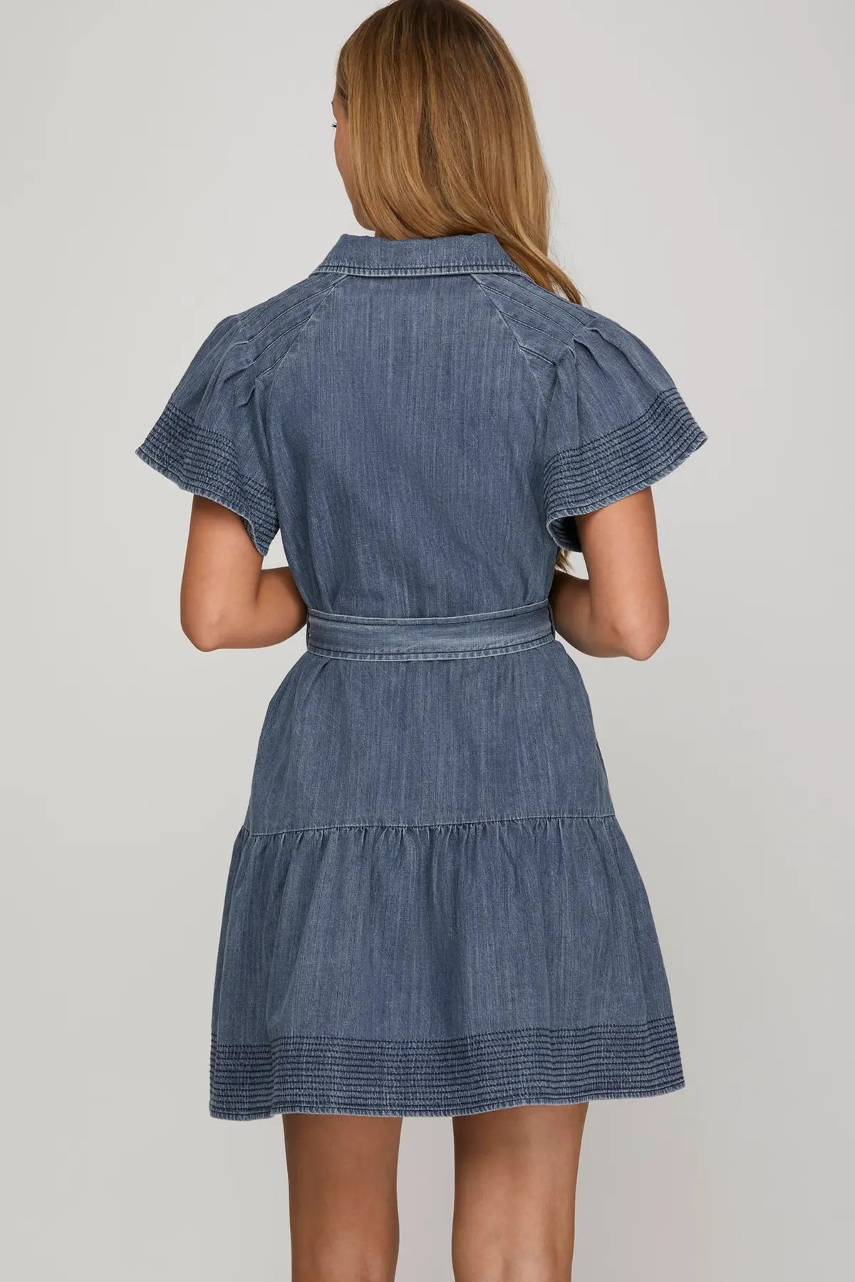STITCHED FLOUNCE SLEEVE BUTTON DOWN WASHED DENIM DRESS WITH WAIST TIE AND POCKETS
