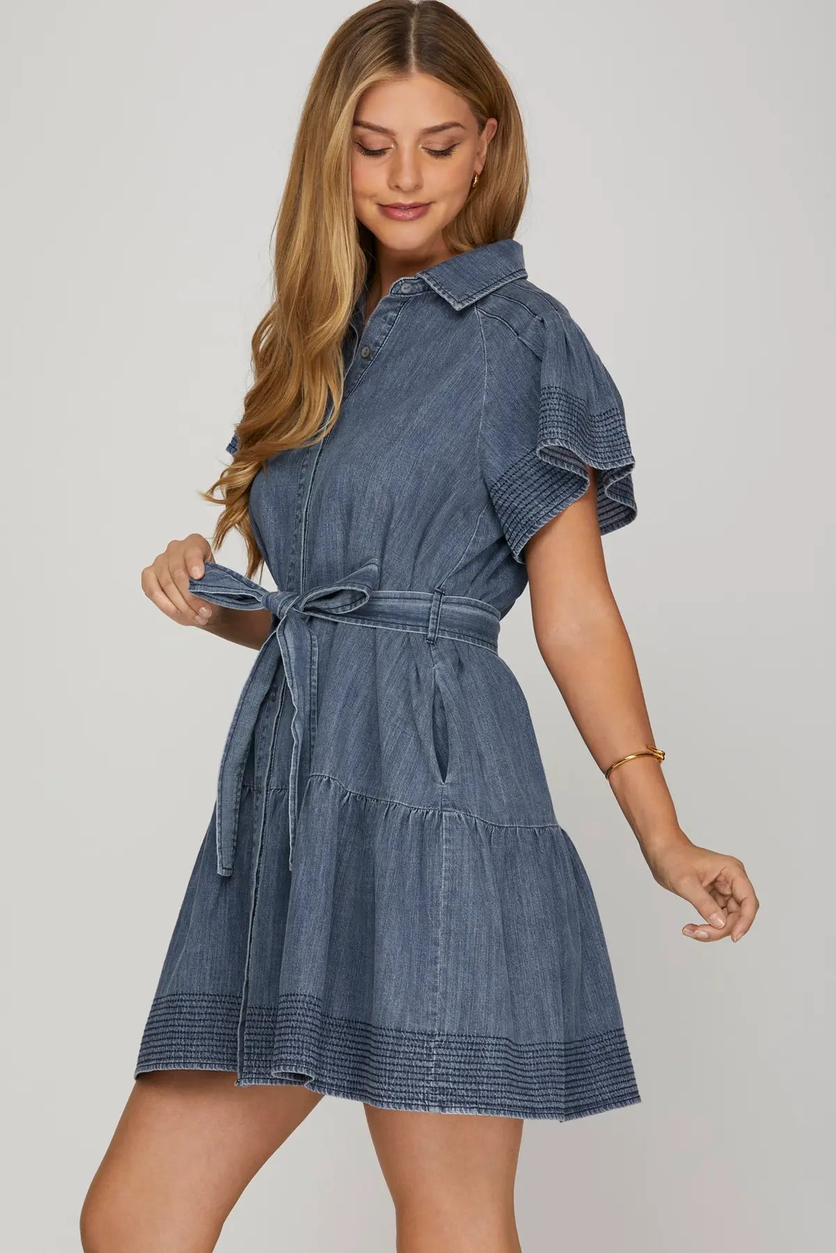 STITCHED FLOUNCE SLEEVE BUTTON DOWN WASHED DENIM DRESS WITH WAIST TIE AND POCKETS