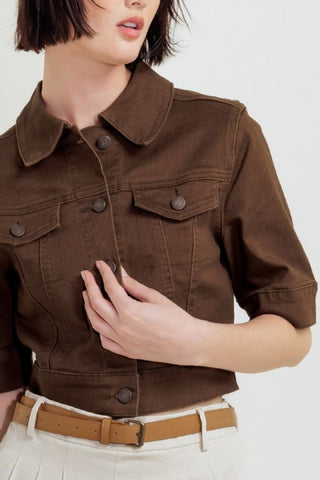 A washed twill jacket with short sleelve and front button closure