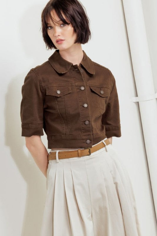 A washed twill jacket with short sleelve and front button closure