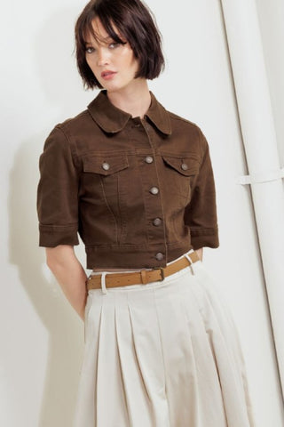 A washed twill jacket with short sleelve and front button closure