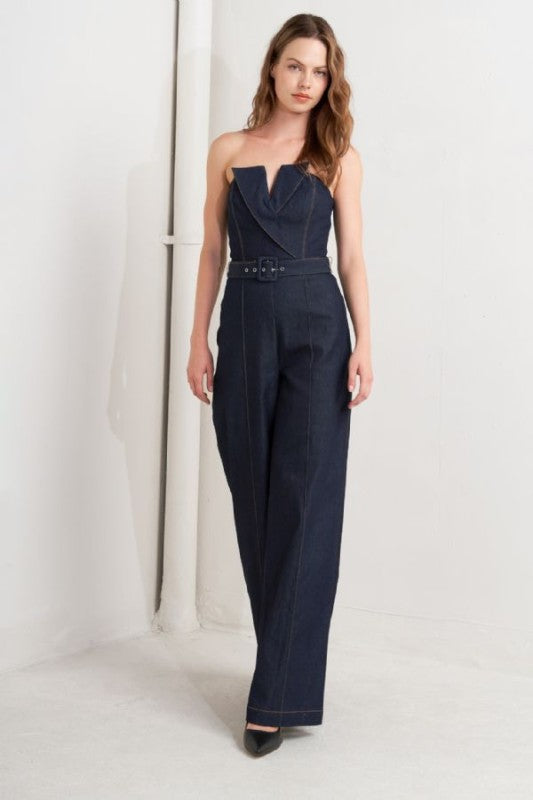 A denim jumpsuit featuring strapless, front fold over detail, self belt and wide leg