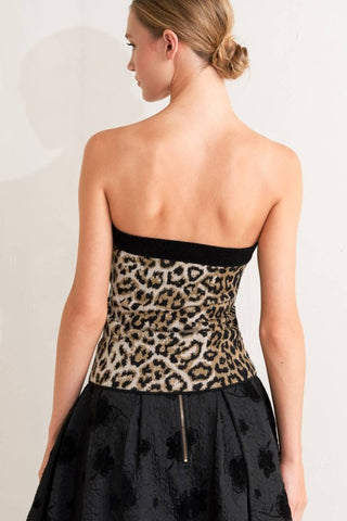 A sweater knit tube top with front button detail