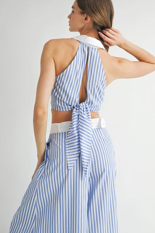 halter-style top with a structured collar and buttons down the middle for a chic, tailored look