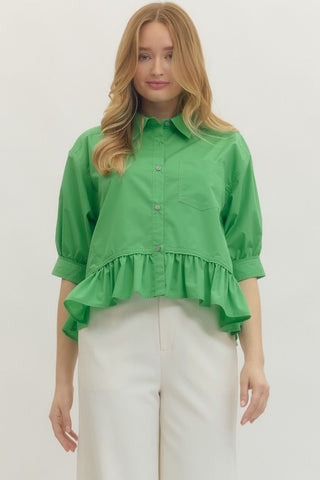 Solid 3/4 sleeve button-down top featuring ruffle hem detail