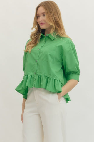 Solid 3/4 sleeve button-down top featuring ruffle hem detail