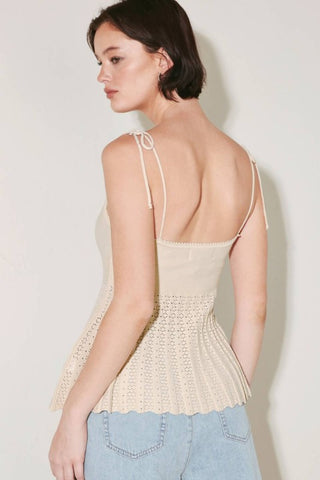 A sweater knit top with shoulder ties