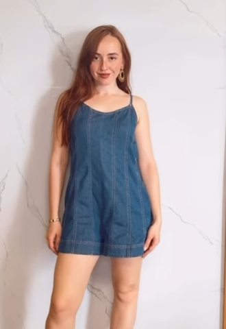 A Light Denim Romper with Back Tie and Zipper Closure