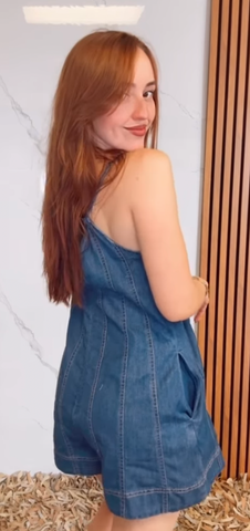 A Light Denim Romper with Back Tie and Zipper Closure