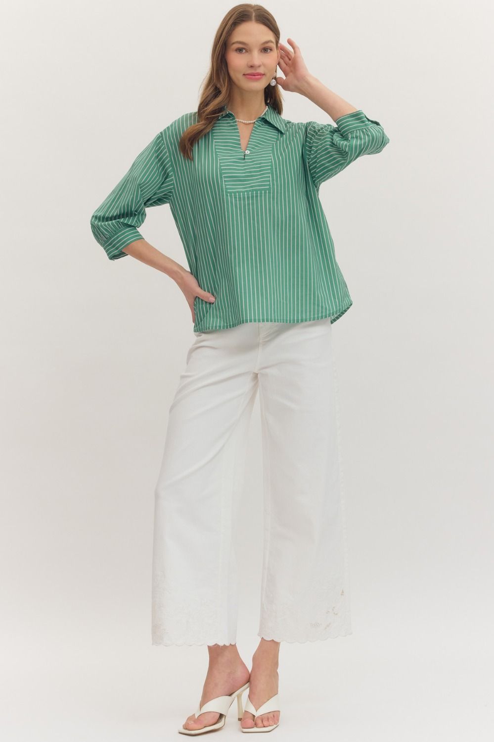 Striped 3/4 sleeve top featuring split neck placket detail