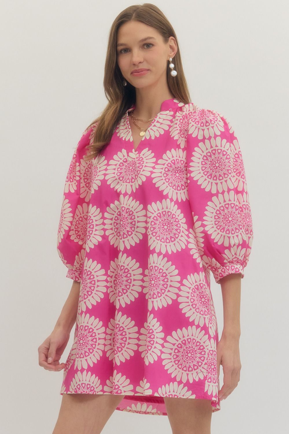 Print puff sleeve mini dress featuring V-neckline. Side pockets. Lined. Woven. Non-sheer. Lightweight.