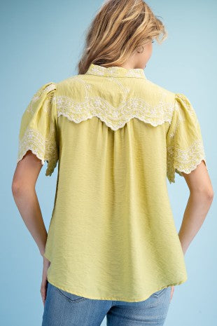 Embroidered Top with Scalloped Details and a Neckline Button Closure