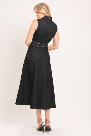 A solid woven midi dress featuring collar, sleeveless, front zipper closure, stud embellishments, side pockets and circle skirt