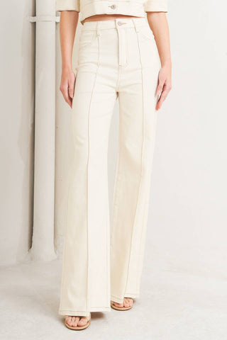 A twill pant featuring front closure, pockets, center seam and flare leg.