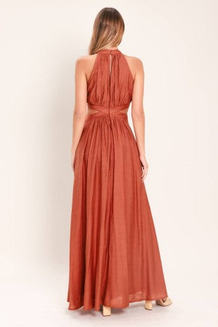 A solid woven maxi dress featuring halter neckline, side cut out and back button/zipper closure