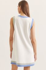 Solid sleeveless mini dress featuring V-neck with contrast trim. Side pockets. Unlined. Knit.