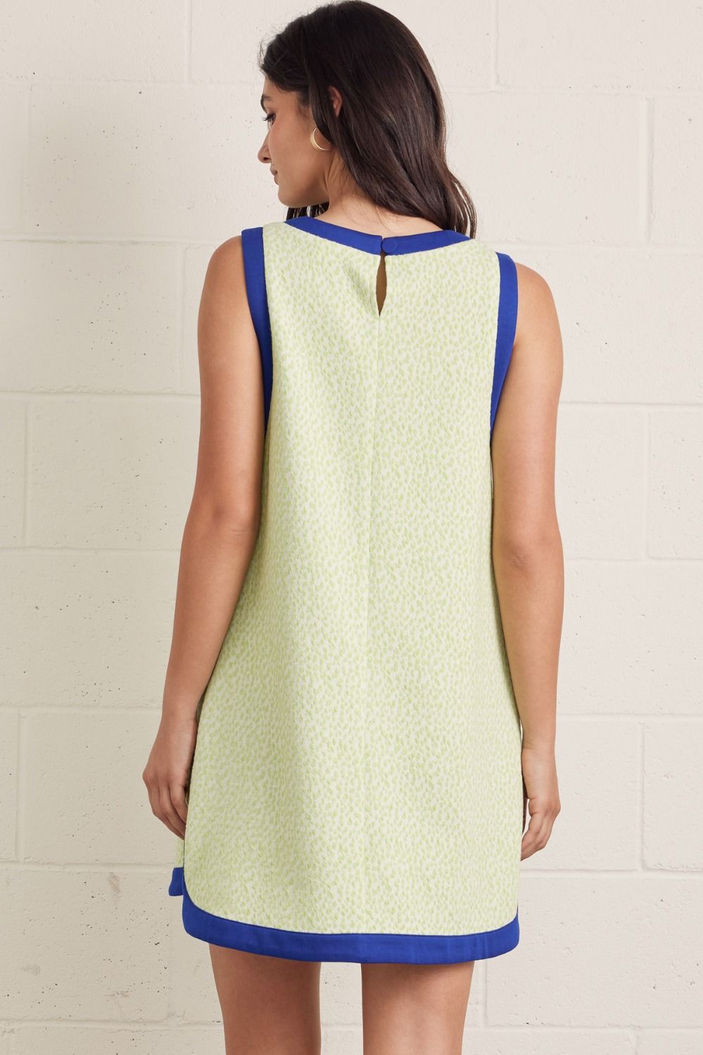 Textured sleeveless mini dress featuring contrast binding