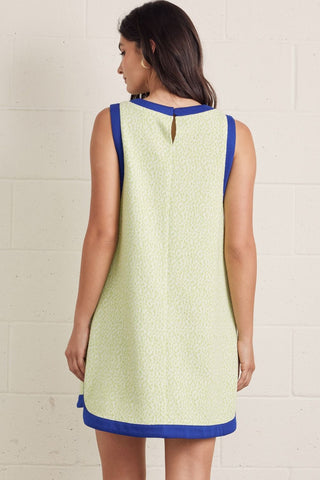 Textured sleeveless mini dress featuring contrast binding