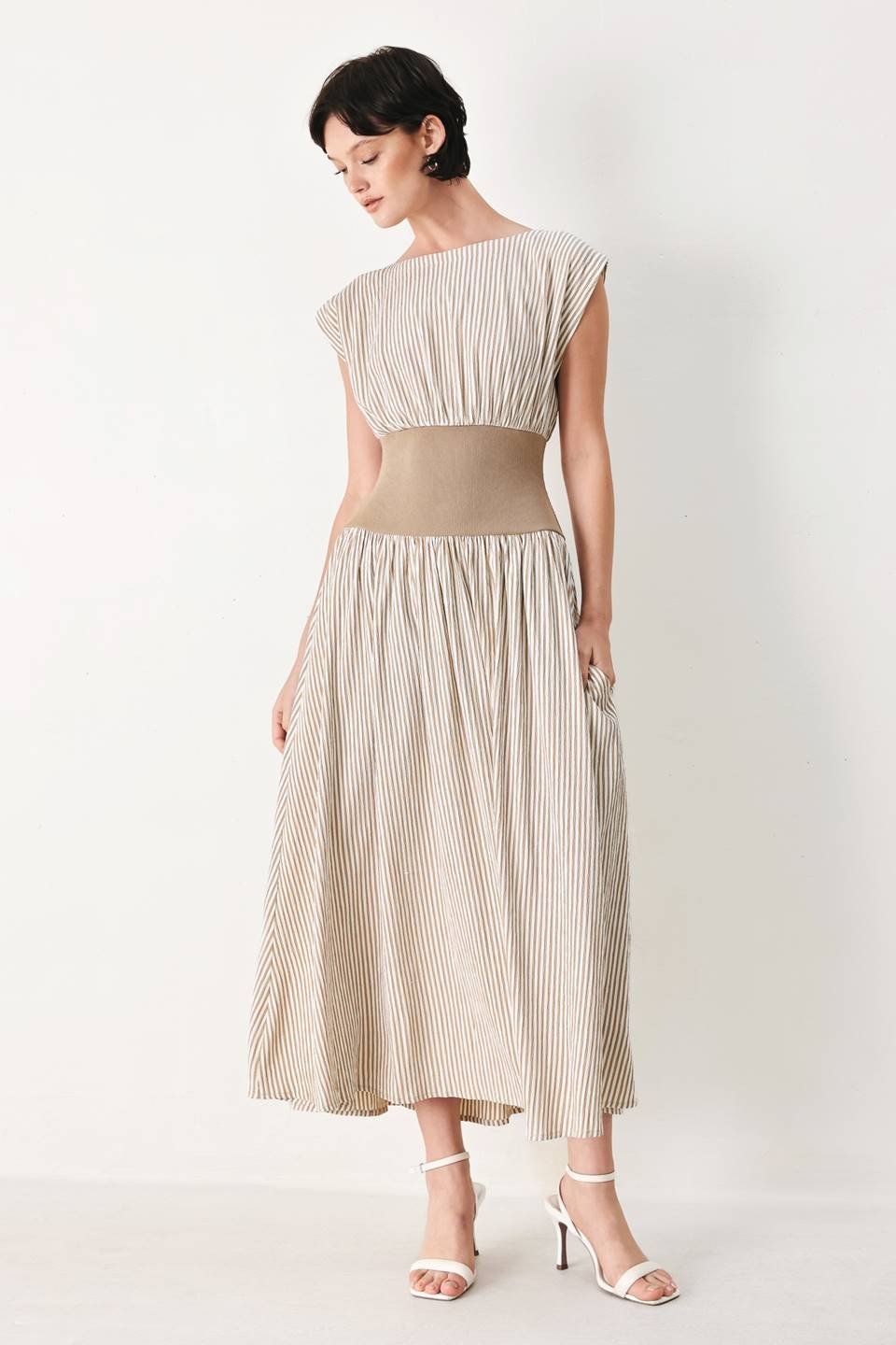 A striped woven midi dress featuring wide neckline, cap sleeve, wide ribbed knit waist, full skirt and back zipper closure