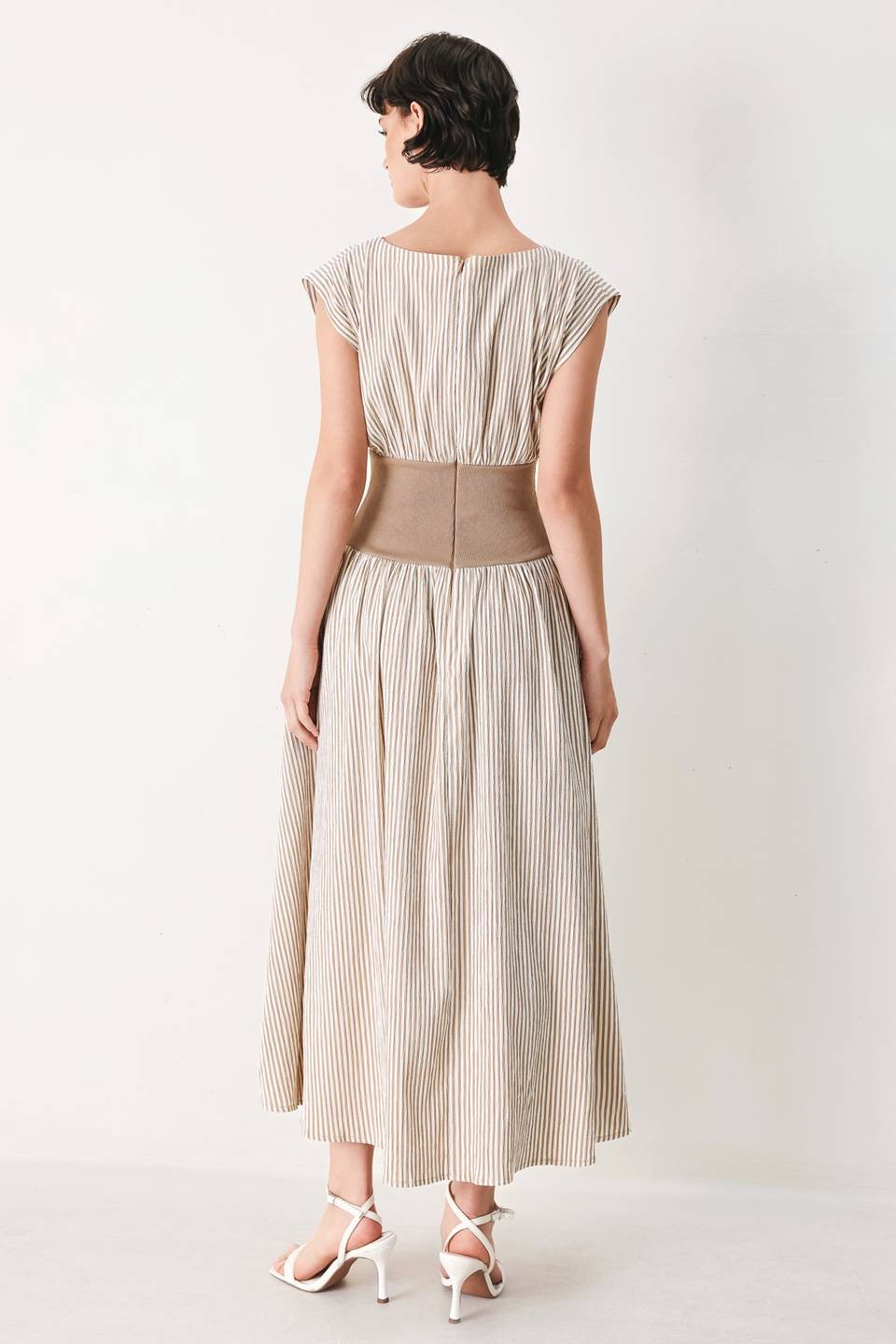 A striped woven midi dress featuring wide neckline, cap sleeve, wide ribbed knit waist, full skirt and back zipper closure