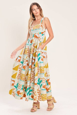 A printed woven midi dress featuring straight neckline with ric-rac ribbon trim, circle skirt and smocked back bodice