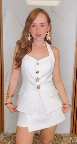 A solid woven vest featuring sweetheart neckline, button down and peplum.