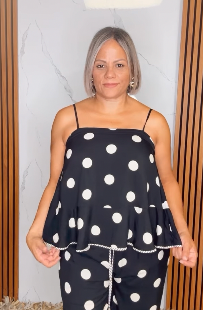 Polka dot sleeveless peplum top featuring square neckline
