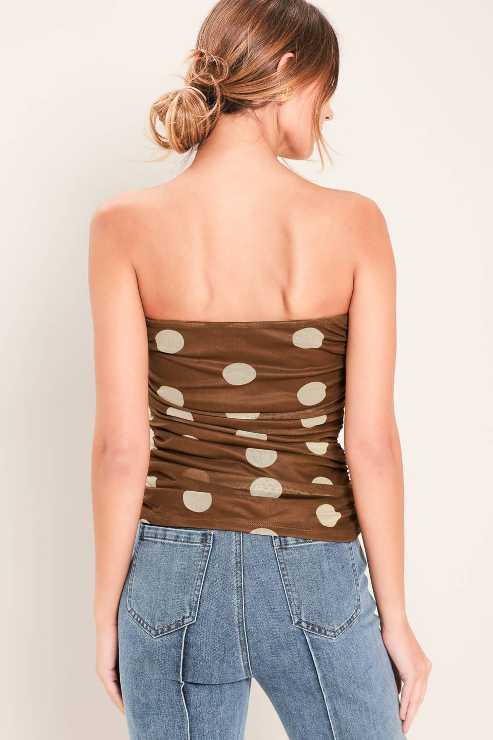 A printed power mesh tube top with side shirring.