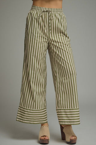 Striped wide-leg pants featuring elastic waistband with drawstring. Side pockets. Lined. Woven. Non-sheer. Lightweight.