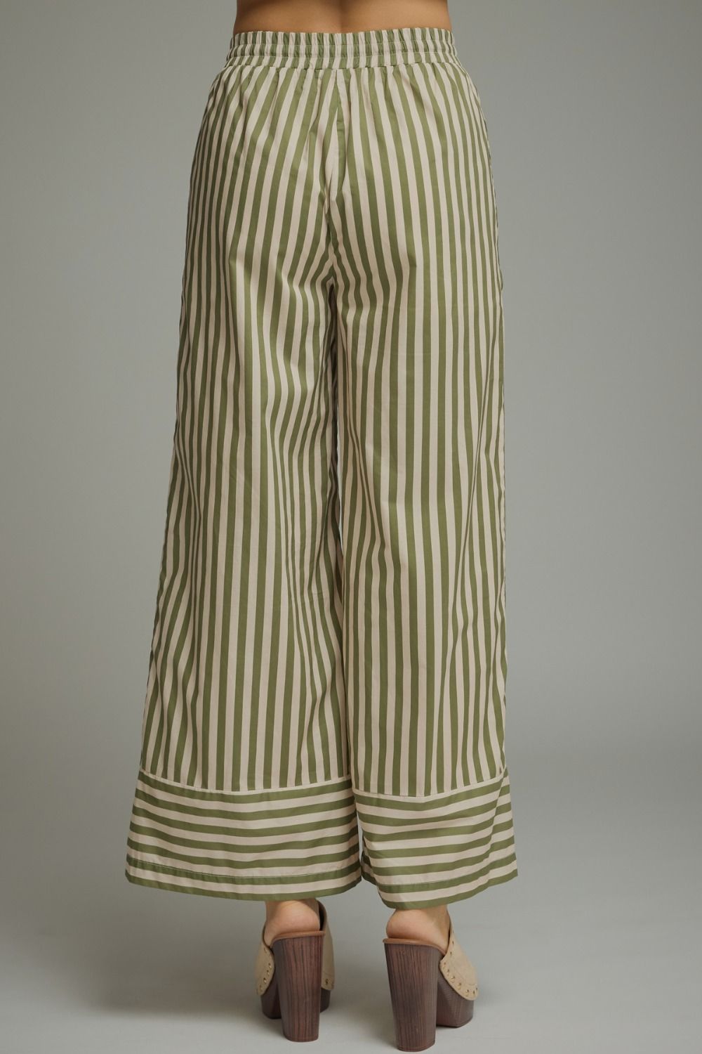 Striped wide-leg pants featuring elastic waistband with drawstring. Side pockets. Lined. Woven. Non-sheer. Lightweight.