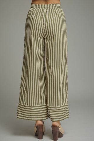 Striped wide-leg pants featuring elastic waistband with drawstring. Side pockets. Lined. Woven. Non-sheer. Lightweight.