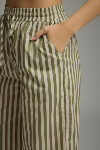 Striped wide-leg pants featuring elastic waistband with drawstring. Side pockets. Lined. Woven. Non-sheer. Lightweight.