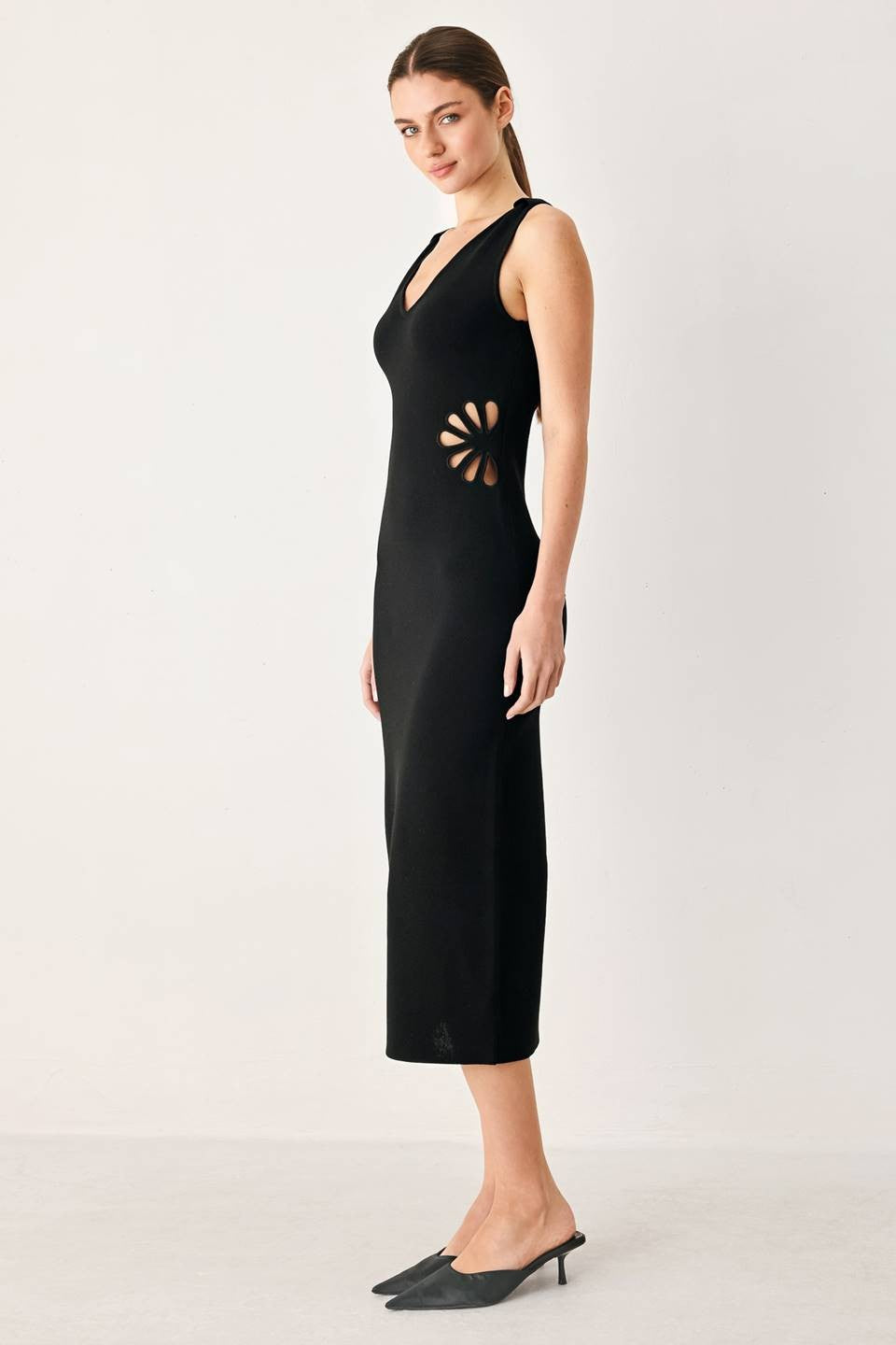 A sweater knit midi dress featuring V neckline and side cut out