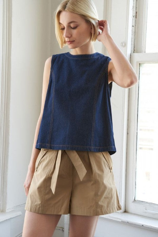 A denim top featuring round neckline, sleeveless and open back with tie closure
