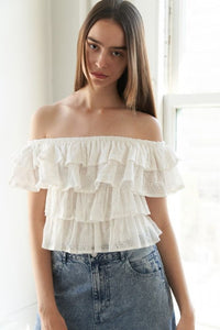 A woven eyelet off shoulder top