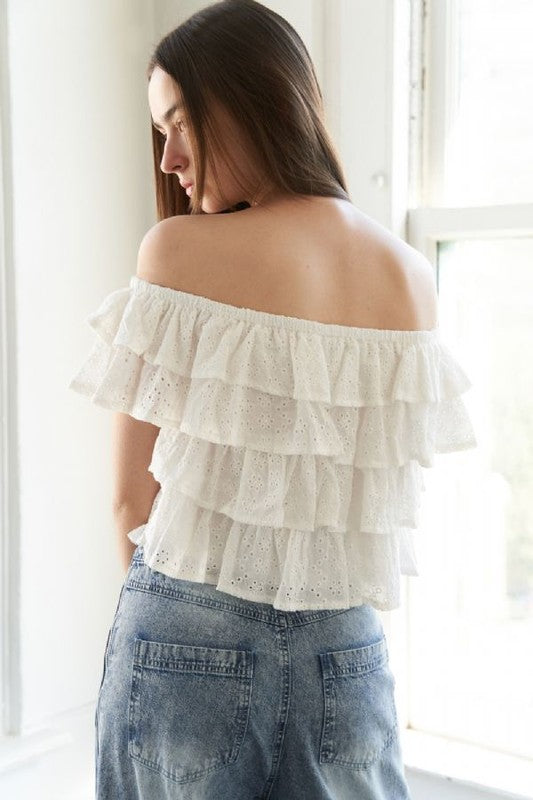 A woven eyelet off shoulder top