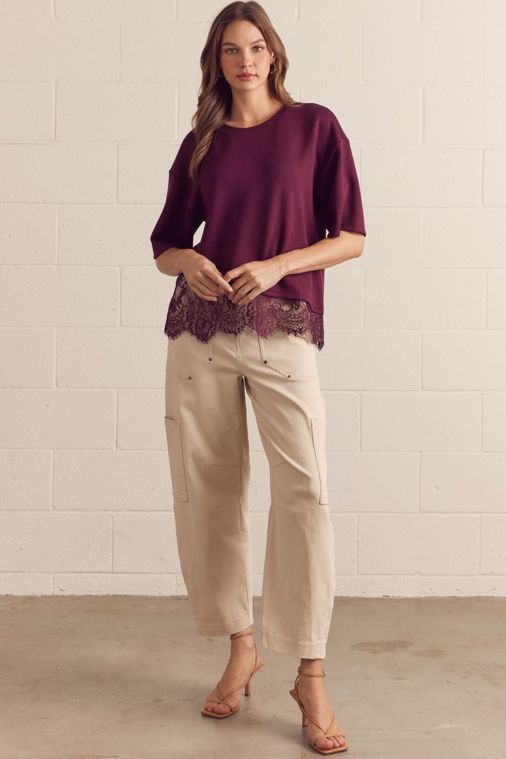 Solid short sleeve knit top featuring scallop lace hem detail
