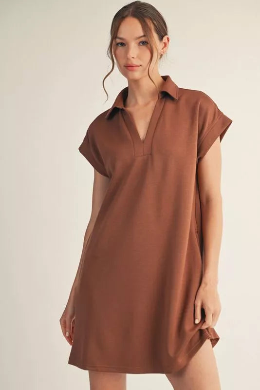 Solid dress with open collared neck, back inverted pleats, side pockets