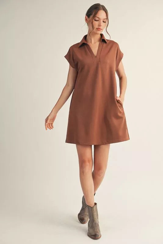 Solid dress with open collared neck, back inverted pleats, side pockets
