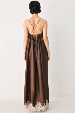 A solid woven midi slip dress with lace hem